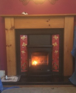 Tiger Inset stove installed into customers existing cast iron surround 